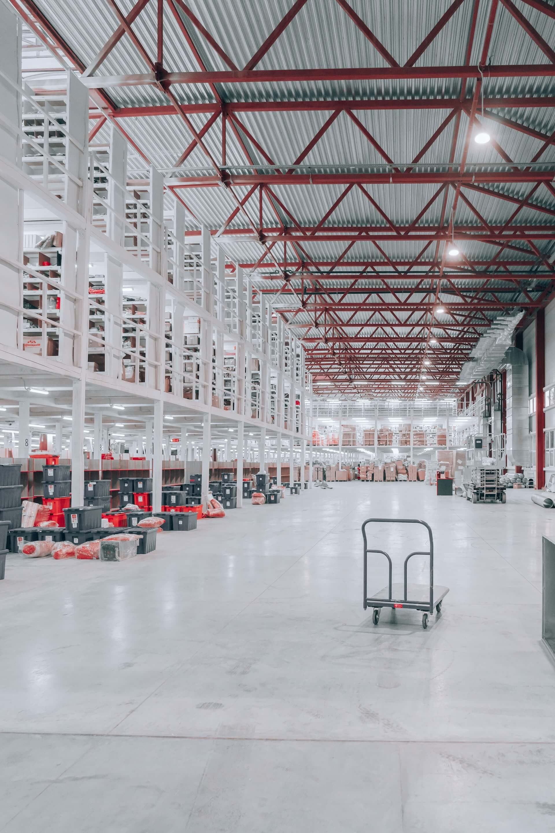 Long, clean warehouse aisle with a sealed concrete floor